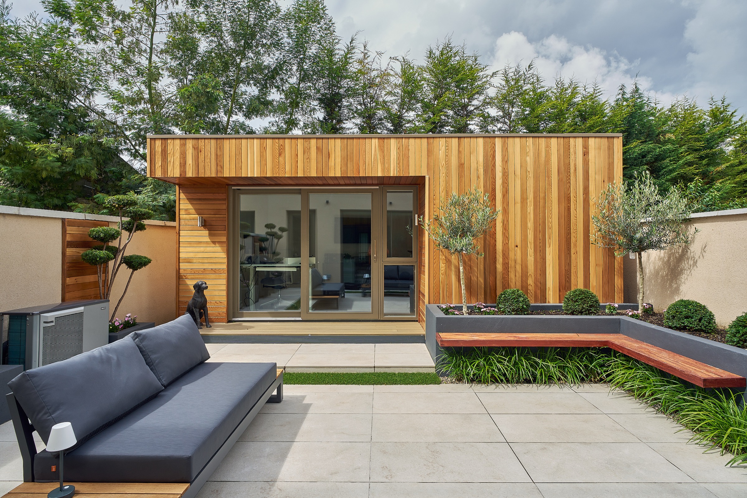 A cedar-clad Shomera garden studio in a landscaped courtyard garden